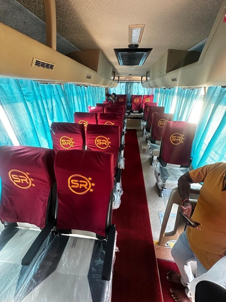Group vehicle interior with passenger seating for tours from Kadapa